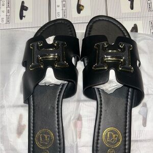 Black Slide Sandals with Gold H-Shield Accent